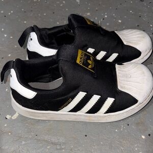 Adidas Kids Black and White Sneakers with Gold Accents